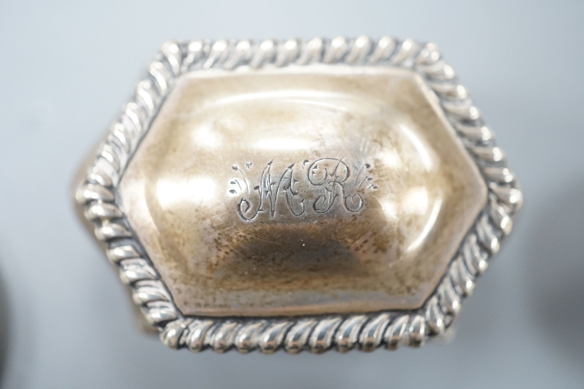 Three silver pill boxes, a key ring and white metal and niello bracelet.